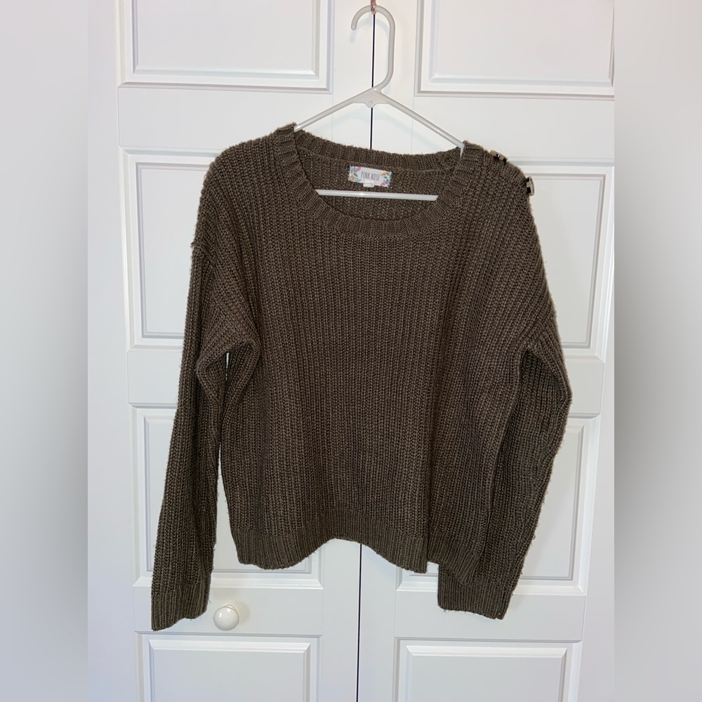 This is a medium sized pink rose knit sweater. Perfect for a fall day!